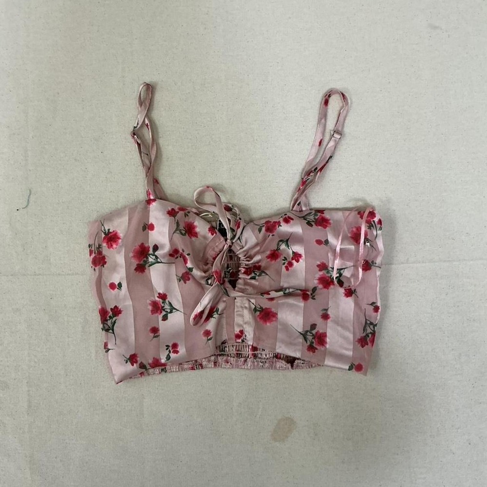 floral crop‎ top featuring adjustable spaghetti straps